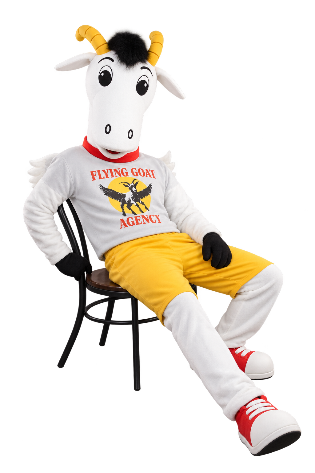 Flying Goat mascot relaxing in a chair